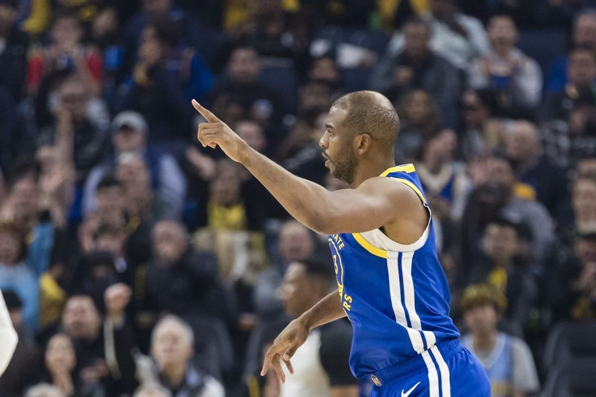 Jan 4, 2024; San Francisco, California, USA; Golden State Warriors guard Chris Paul (3) reacts after hitting a three-point shot against the Denver Nuggets during the first half at Chase Center.