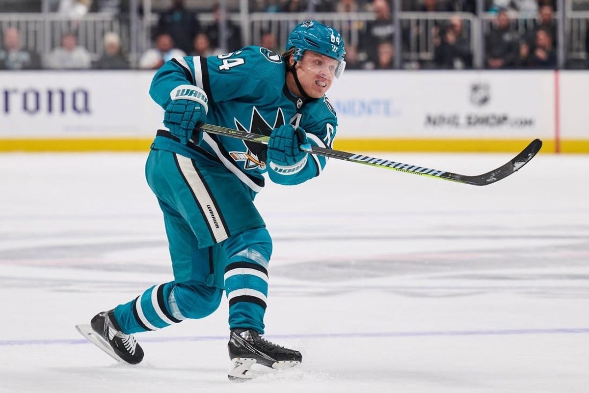 Apr 4, 2024; San Jose, California, USA; San Jose Sharks center Mikael Granlund (64) shoots the puck against the Los Angeles Kings during the second period at SAP Center at San Jose.