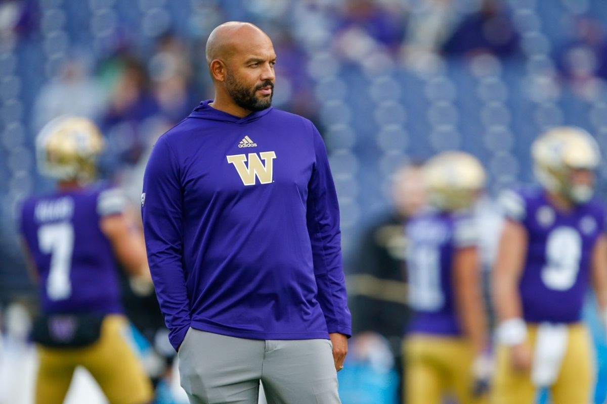 Oct 16, 2021; Seattle, Washington, USA; Washington Huskies head coach Jimmy Lake watches pregame warmups against the UCLA Bruins at Alaska Airlines Field at Husky Stadium. Mandatory Credit: Joe Nicholson-Imagn Images