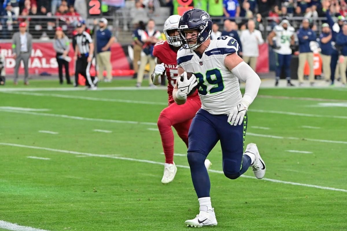 Jan 7, 2024; Glendale, Arizona, USA; Seattle Seahawks tight end Will Dissly (89) scores a touchdown in the first half against the Arizona Cardinals at State Farm Stadium.