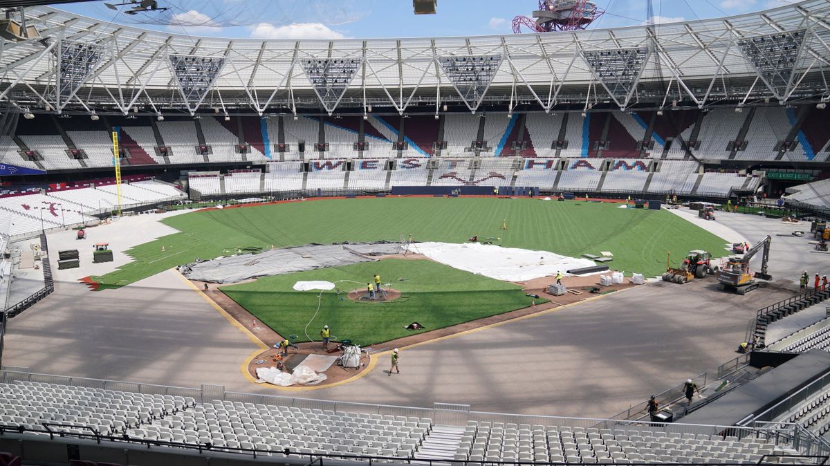 Workers transform the pitch into a baseball field at the London Stadium, home of West Ham United