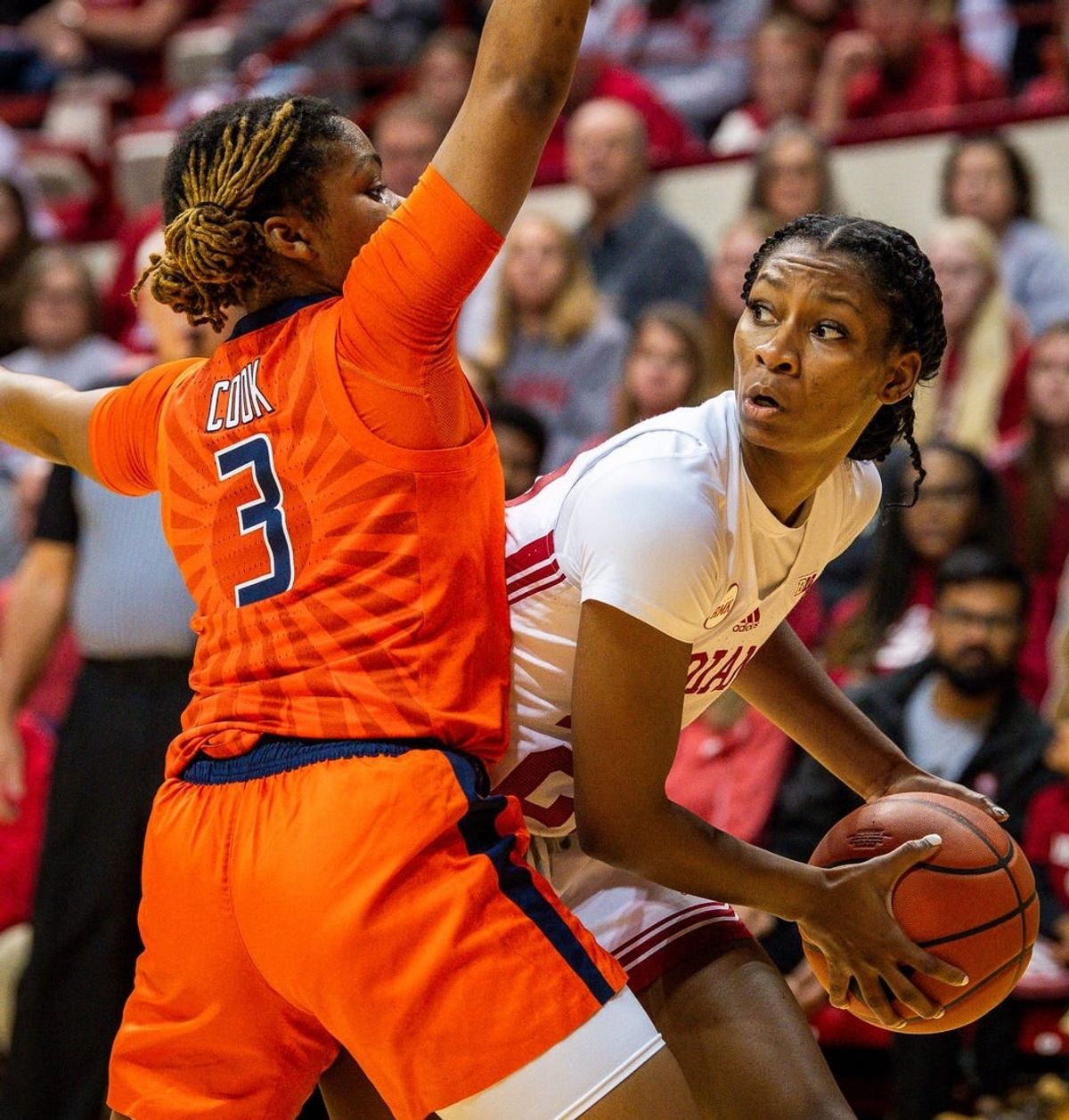 Indiana's Chloe Moore-McNeil (22) looks to pass around Illinois' Makira Cook (3) during the first half of the Indiana versus Illinois women's basketball game at Simon Skjodt Assembly Hall on Sunday, Dec. 31, 2023.