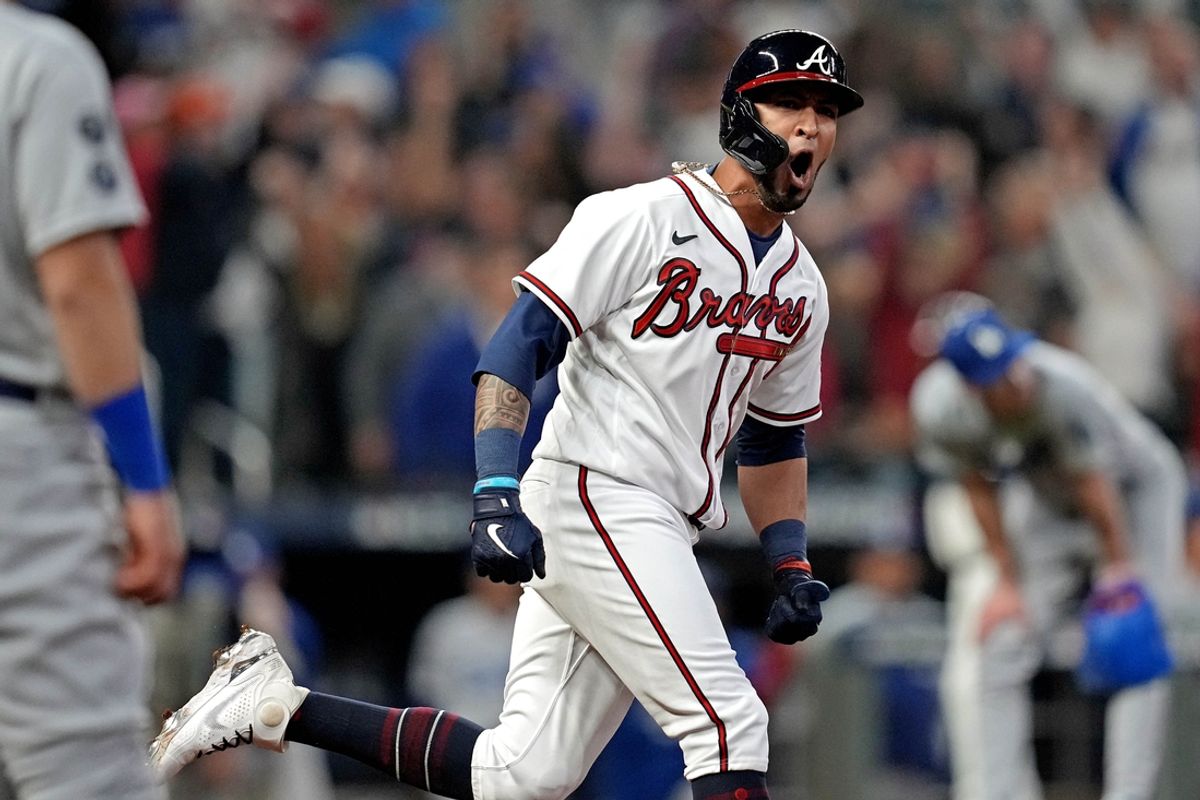 Oct 23, 2021; Cumberland, Georgia, USA; Atlanta Braves left fielder Eddie Rosario (8) hits a three run home run during the fourth inning against the Los Angeles Dodgers in game six of the 2021 NLCS at Truist Park. Mandatory Credit: Dale Zanine-Imagn Images