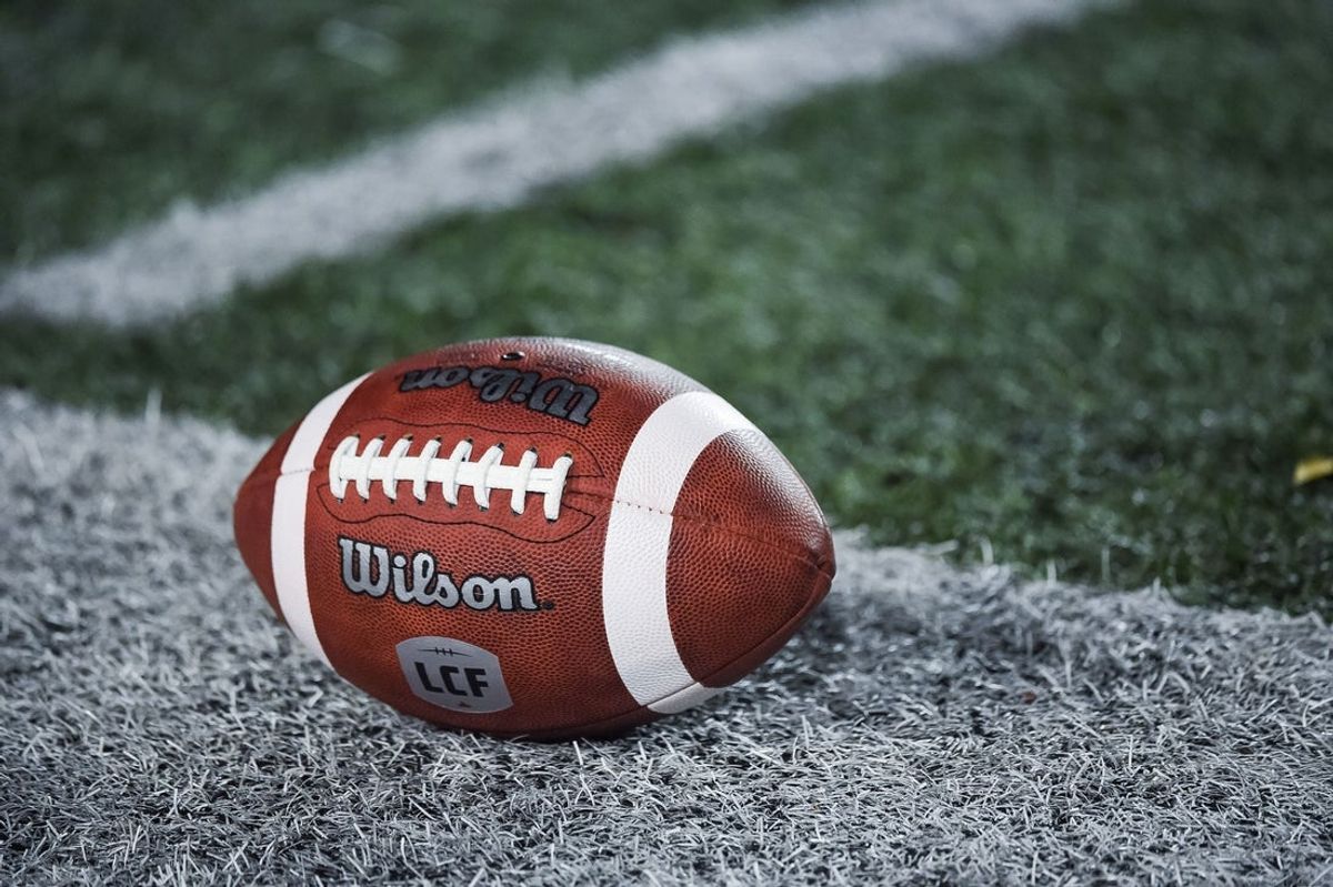Oct 22, 2021; Montreal, Quebec, CAN; view of a CFL game ball with a french logo on the field before the first quarter during a Canadian Football League game at Molson Stadium. Mandatory Credit: David Kirouac-Imagn Images