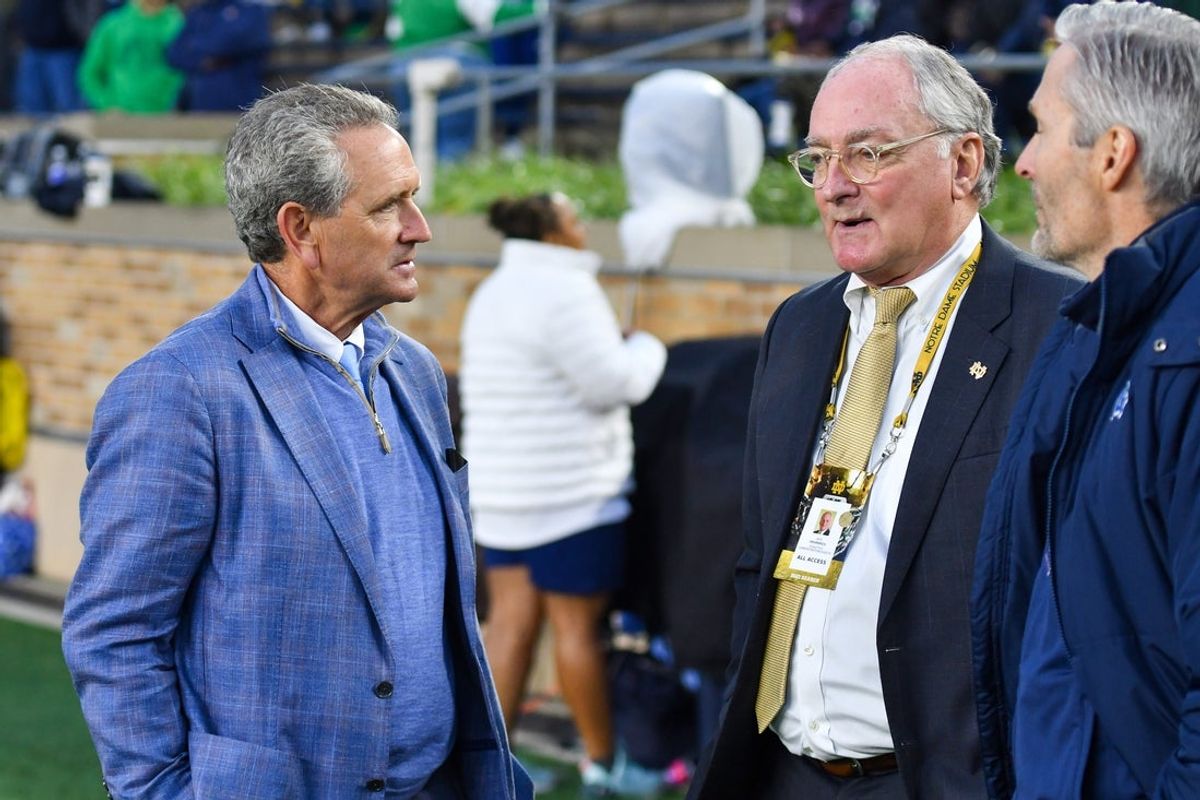 North Carolina Athletics Director Lawrence R. "Bubba" Cunningham, left, chats with Notre Dame Athletic Director Jack Swarbrick before the game between the Notre Dame Fighting Irish and the North Carolina Tar Heels at Notre Dame Stadium. Mandatory Credit: Matt Cashore-Imagn Images