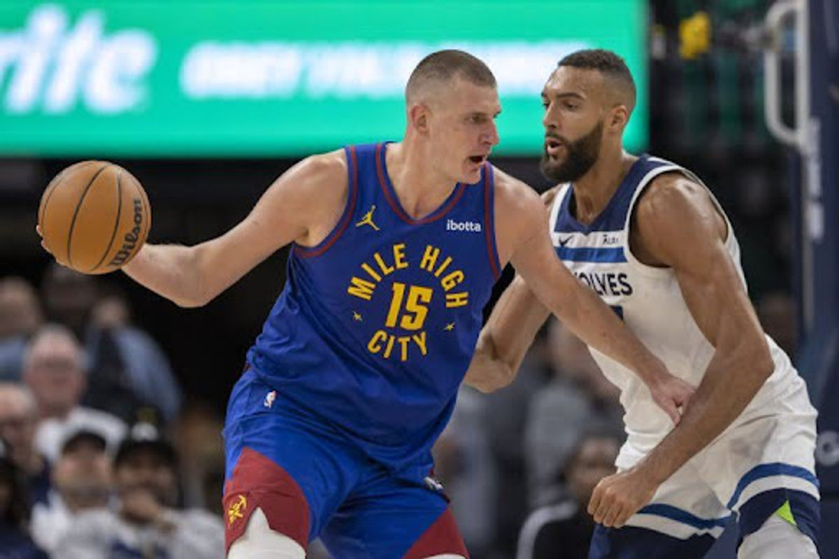 Denver Nuggets center Nikola Jokic (15) controls the ball as Minnesota Timberwolves center Rudy Gobert (27) defends in the second half during game three of the second round for the 2024 NBA playoffs at Target Center. Mandatory Credit: Jesse Johnson-USA TODAY Sports