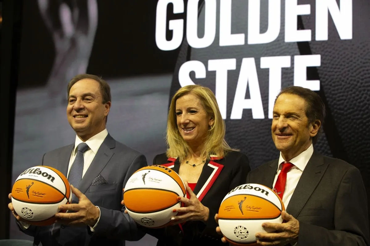 Oct 5, 2023; San Francisco, CA, USA; Golden State Warriors co-executive director & chief executive officer Joe Lacob, WNBA commissioner Cathy Engelbert and Warriors co-executive director Peter Guber pose for a group photo during a press conference to announce an expansion WNBA franchise in the San Francisco Bay Area at Chase Center. Mandatory Credit: D. Ross Cameron-USA TODAY Sports