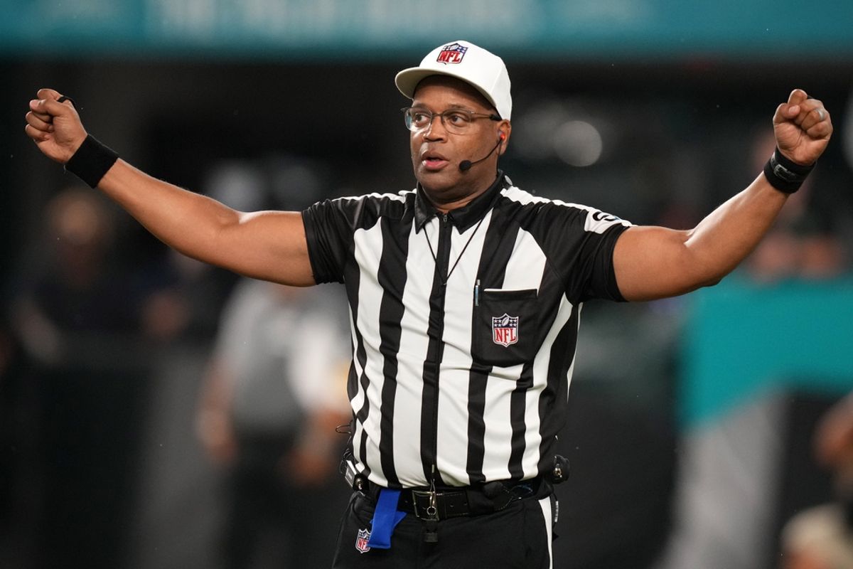 Nov 11, 2021; Miami Gardens, Florida, USA; NFL referee Ron Torbert (62) signals during the second half between the Miami Dolphins and the Baltimore Ravens at Hard Rock Stadium. Mandatory Credit: Jasen Vinlove-Imagn Images