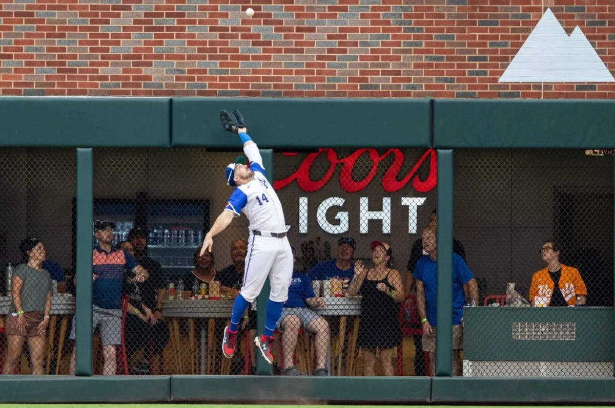 Jun 29, 2024; Cumberland, Georgia, USA; Atlanta Braves outfielder Adam Duvall (14) jumps the catch fly ball against the Pittsburgh Pirates during the eighth inning at Truist Park. Mandatory Credit: Jordan Godfree-USA TODAY Sports