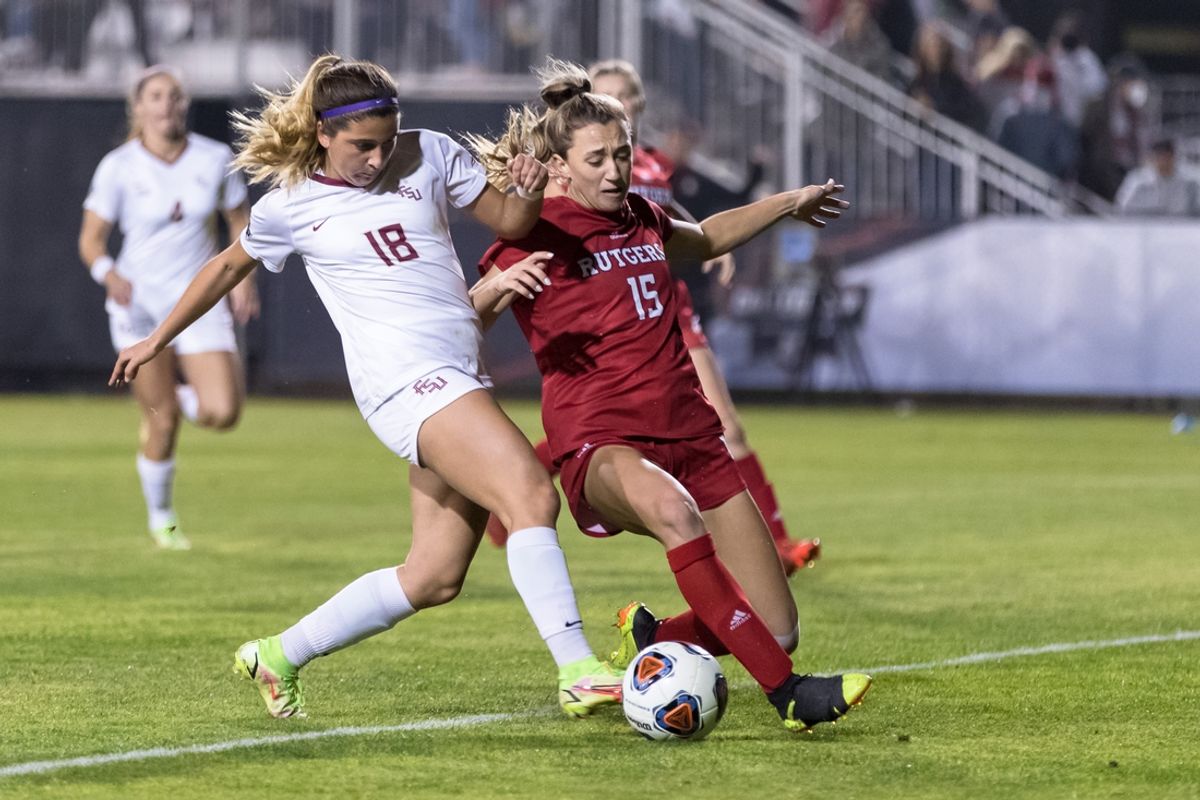 Dec 3, 2021; Santa Clara, CA, USA; Florida State Seminoles midfielder Maria Alagoa (18) and Rutgers Scarlet Knight defender Emily Mason (15) battle for possession in front of goal during the second half of the 2021 Women's College Cup semifinals at Stevens Stadium. Mandatory Credit: John Hefti-Imagn Images