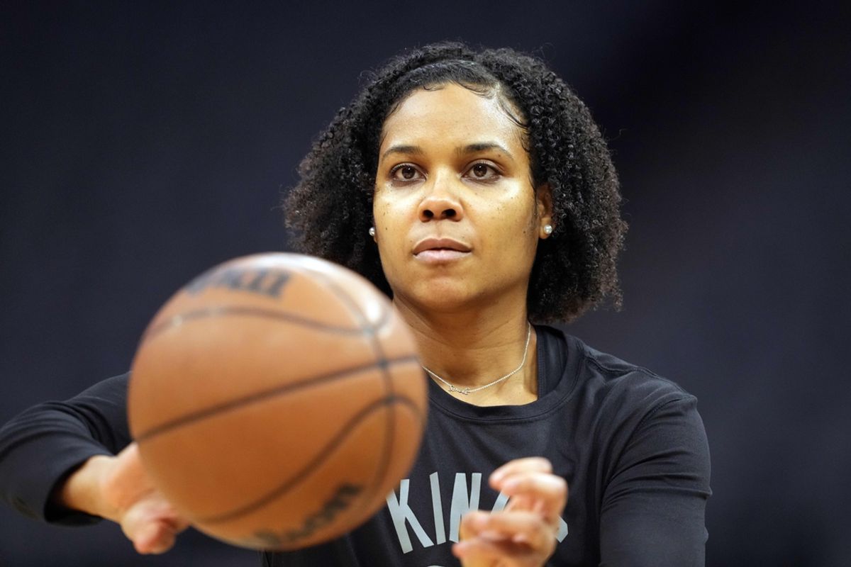 Dec 4, 2021; Sacramento, California, USA; Sacramento Kings player development coach Lindsey Harding passes a ball before a game against the LA Clippers at Golden 1 Center. Mandatory Credit: Darren Yamashita-USA TODAY Sports