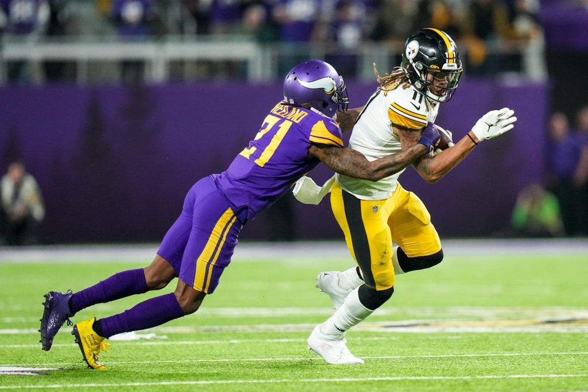Dec 9, 2021; Minneapolis, Minnesota, USA; Pittsburgh Steelers wide receiver Chase Claypool (11) is tackled by Minnesota Vikings cornerback Bashaud Breeland (21) during the fourth quarter at U.S. Bank Stadium. Mandatory Credit: Brace Hemmelgarn-Imagn Images