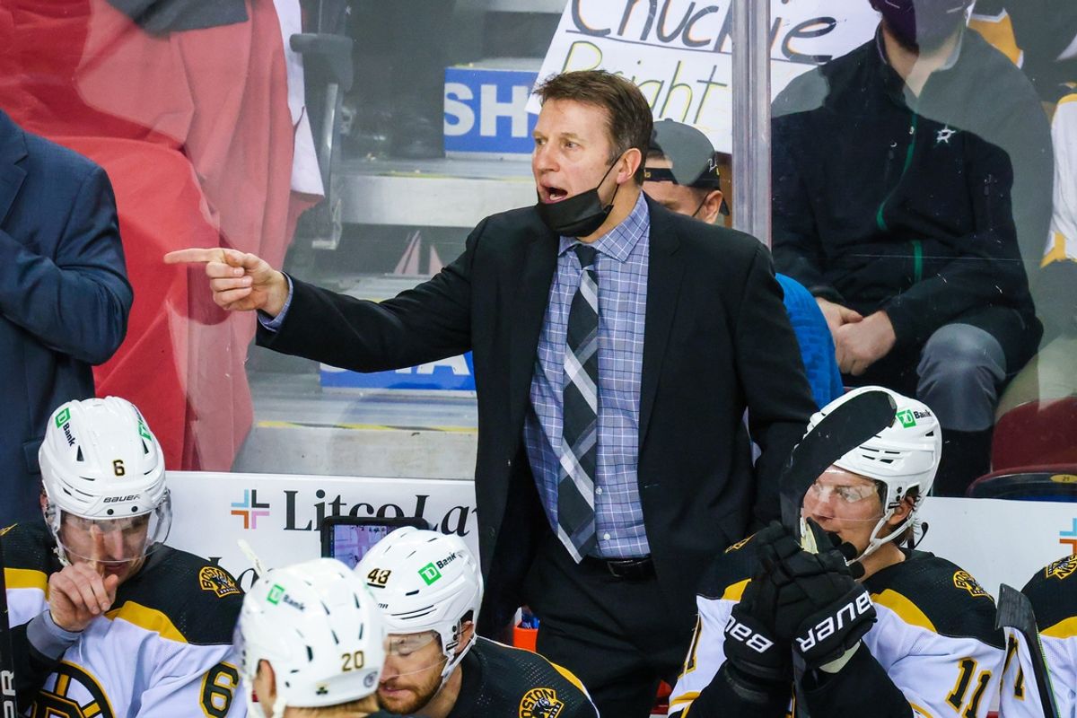Dec 11, 2021; Calgary, Alberta, CAN; Boston Bruins assistant coach Joe Sacco on his bench against the Calgary Flames during the third period at Scotiabank Saddledome. Mandatory Credit: Sergei Belski-Imagn Images
