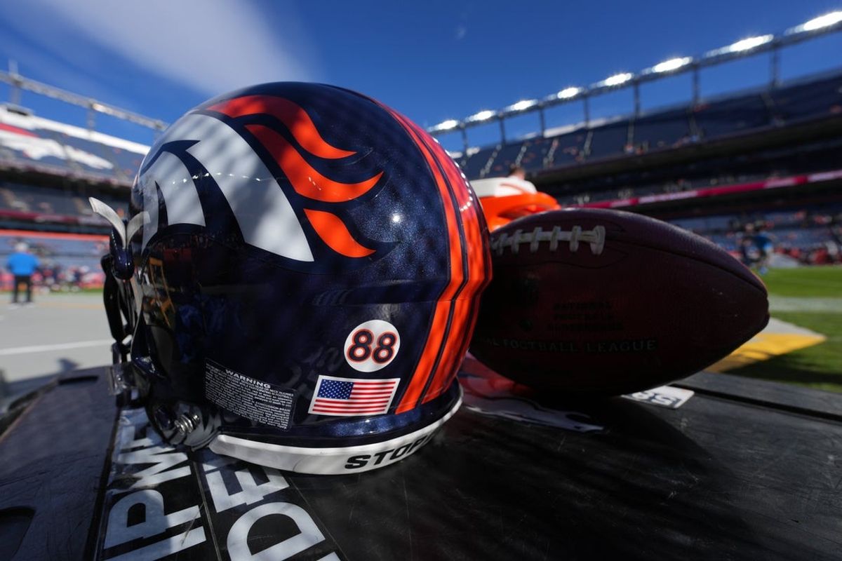 Dec 12, 2021; Denver, Colorado, USA; Detailed view of a memorial sticker on a Denver Broncos helmet in reference to American football player Demaryius Thomas before the game against the Detroit Lions at Empower Field at Mile High. Mandatory Credit: Ron Chenoy-Imagn Images