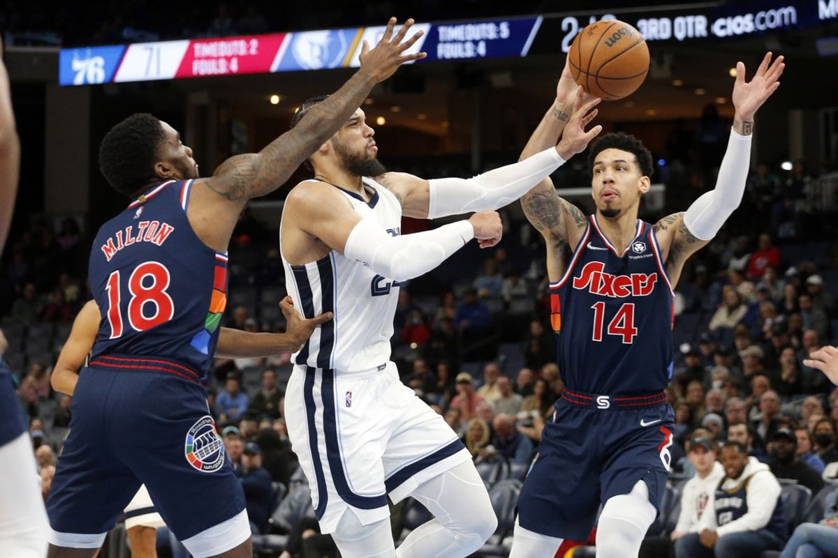 Dec 13, 2021; Memphis, Tennessee, USA; Memphis Grizzles guard Dillon Brooks (24) passes the ball as Philadelphia 76ers guard Shake Milton (18) and forward Danny Green (14) defends during the second half at FedExForum. Mandatory Credit: Petre Thomas-Imagn Images
