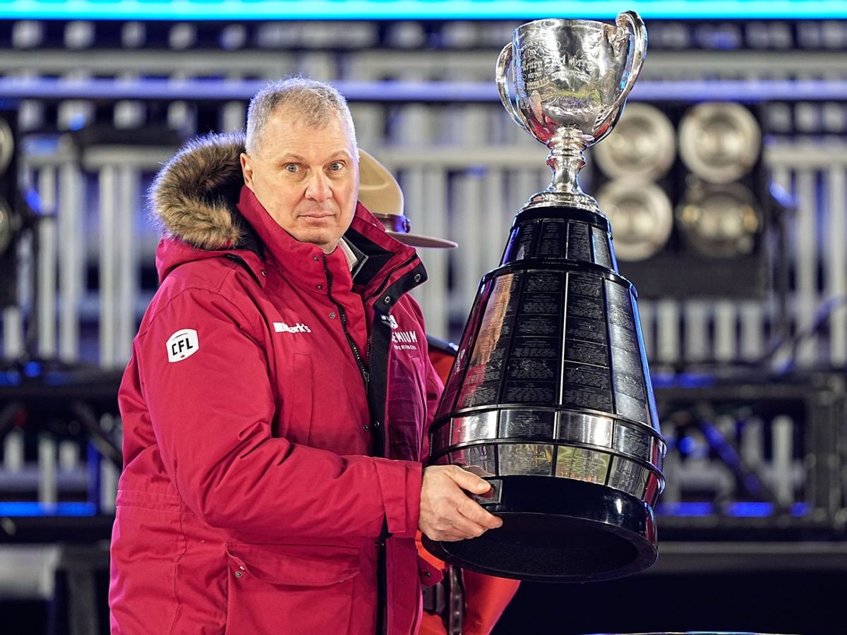 Dec 12, 2021; Hamilton, Ontario, CAN; Canadian Football League commissioner Randy Ambrosie goes to present the Grey Cup to the Winnipeg Blue Bombers after a win over the Hamilton Tiger-Cats in the 108th Grey Cup football game at Tim Hortons Field. Mandatory Credit: John E. Sokolowski-Imagn Images