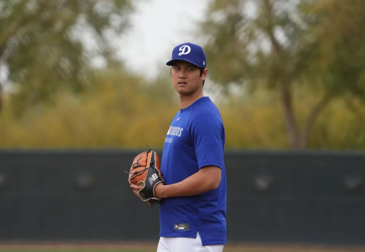 Feb 12, 2025; Glendale, AZ, USA; Los Angeles Dodgers two-way player Shohei Ohtani (17) looks on during a Spring Training workout at Camelback Ranch. Mandatory Credit: Joe Camporeale-Imagn Images