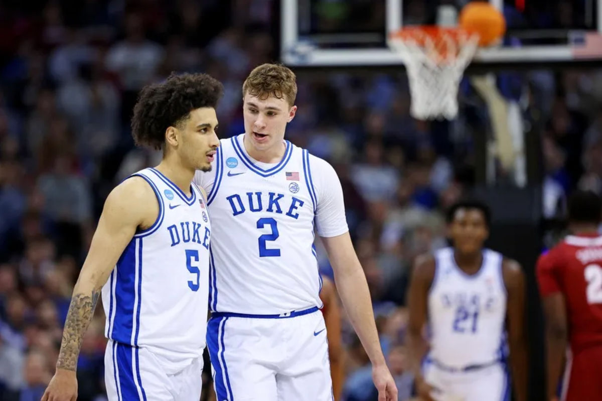 Mar 29, 2025; Newark, NJ, USA; Duke Blue Devils guard Tyrese Proctor (5) talks with forward Cooper Flagg (2) during the second half against the Alabama Crimson Tide in the East Regional final of the 2025 NCAA tournament at Prudential Center. Mandatory Credit: Vincent Carchietta-Imagn Images