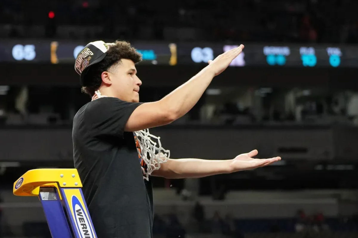 Apr 7, 2025; San Antonio, TX, USA; Florida Gators guard Walter Clayton Jr. (1) reacts after cutting down a piece of the net after winning the national championship game of the Final Four of the 2025 NCAA Tournament at the Alamodome. Mandatory Credit: Bob Donnan-Imagn Images