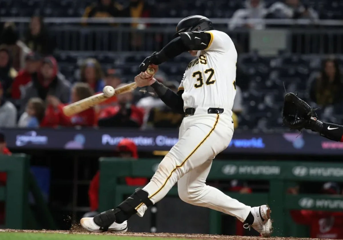 Apr 16, 2025; Pittsburgh, Pennsylvania, USA; Pittsburgh Pirates catcher Henry Davis (32) drives in a run with a broken bat ground out against the Washington Nationals during the seventh inning at PNC Park. Mandatory Credit: Charles LeClaire-Imagn Images