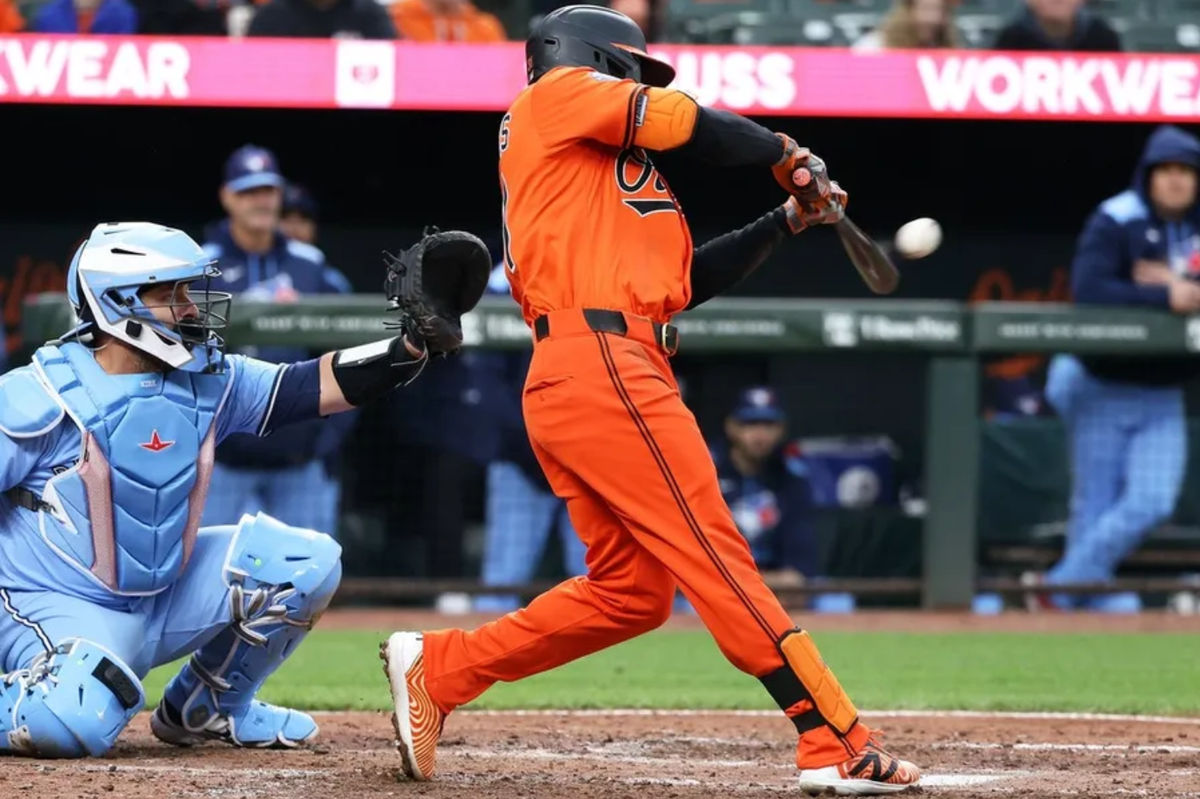 Apr 12, 2025; Baltimore, Maryland, USA; Baltimore Orioles outfielder Cedric Mullins (31) hits an RBI double during the sixth inning against the Toronto Blue Jays at Oriole Park at Camden Yards. Mandatory Credit: Daniel Kucin Jr.-Imagn Images