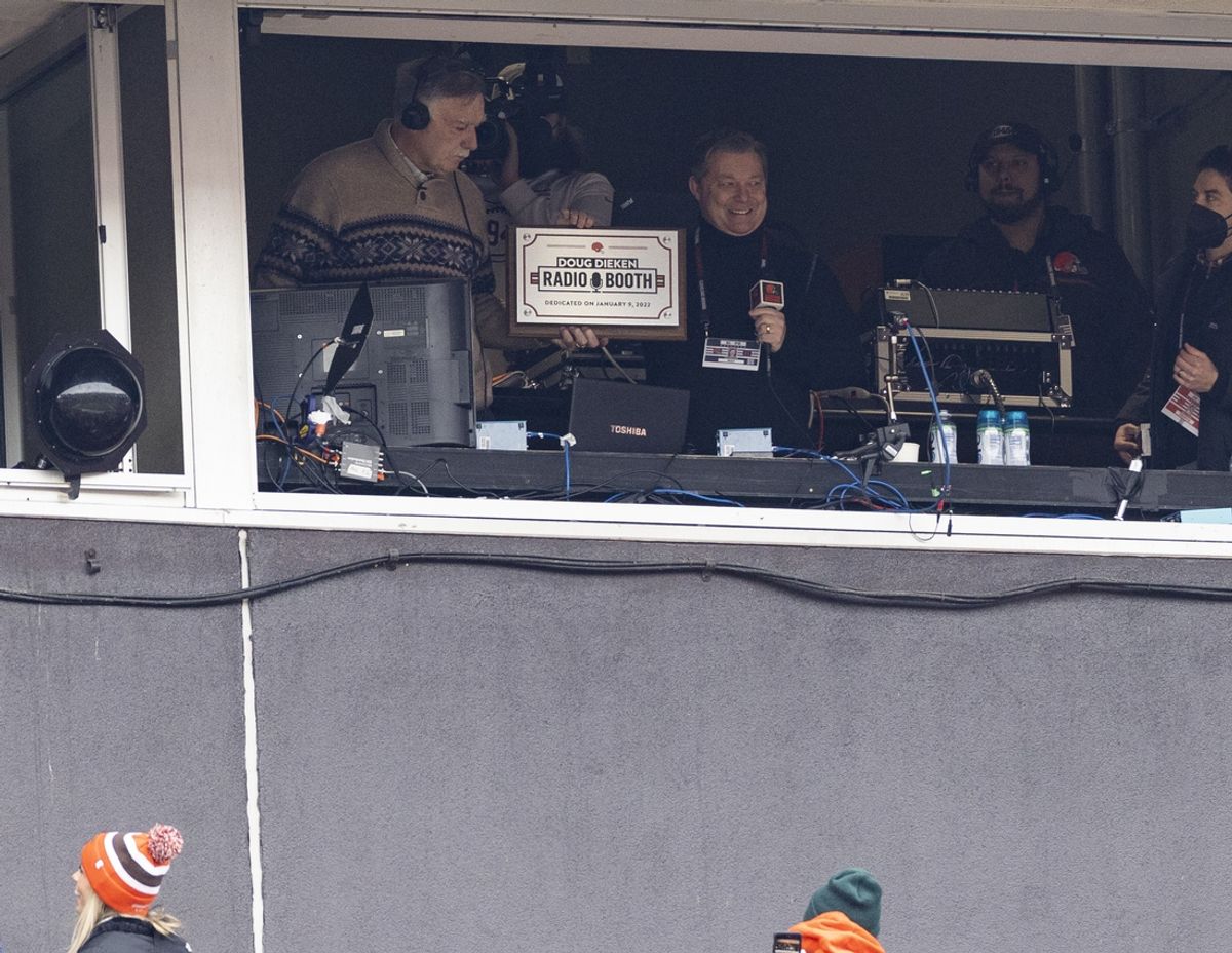 Jan 9, 2022; Cleveland, Ohio, USA; Cleveland Browns radio color analyst Doug Dieken (left) is presented with a plaque by radio play-by-play announcer Jim Donovan for the radio booth dedication for his retirement from announcing Cleveland Browns football games during the first half against the Cincinnati Bengals at FirstEnergy Stadium. Mandatory Credit: Scott Galvin-Imagn Images