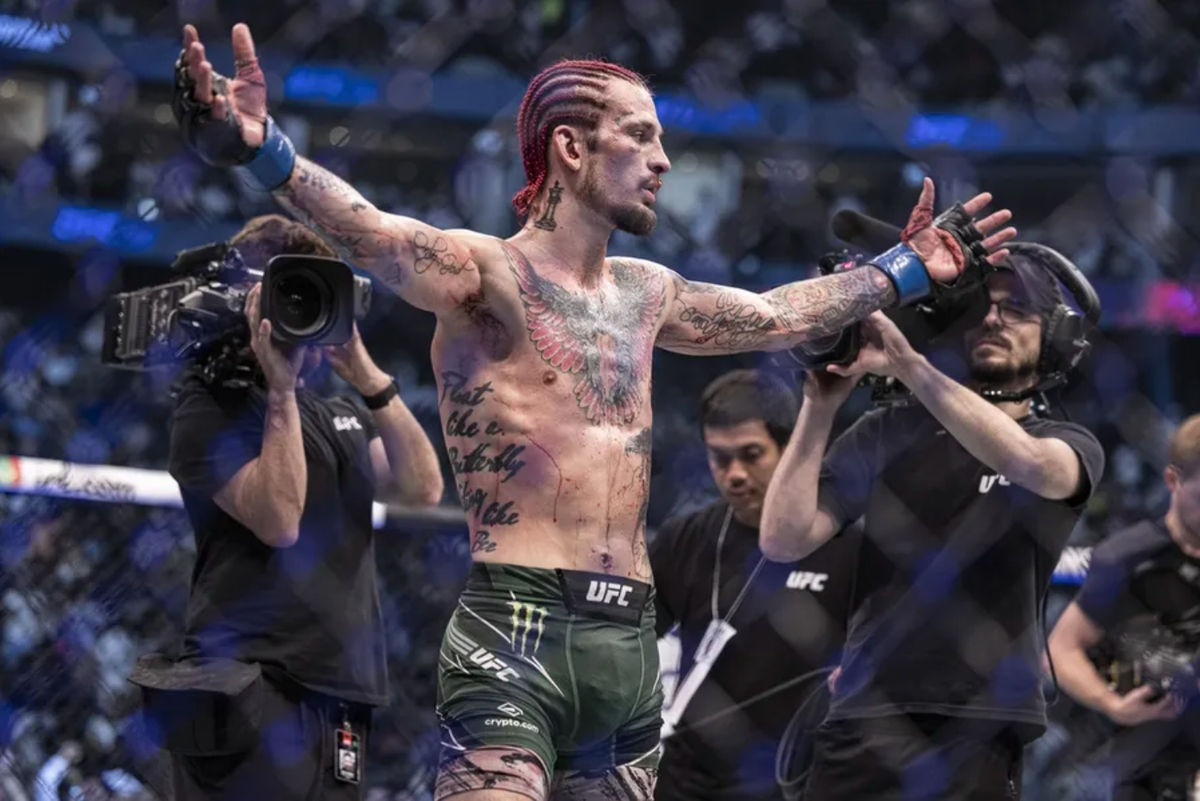 Oct 22, 2022; Abu Dhabi, UAE; Sean O'Malley (blue gloves) defeats Petr Yan (red gloveS) during UFC 280 at Etihad Arena. Mandatory Credit: Craig Kidwell-Imagn Images