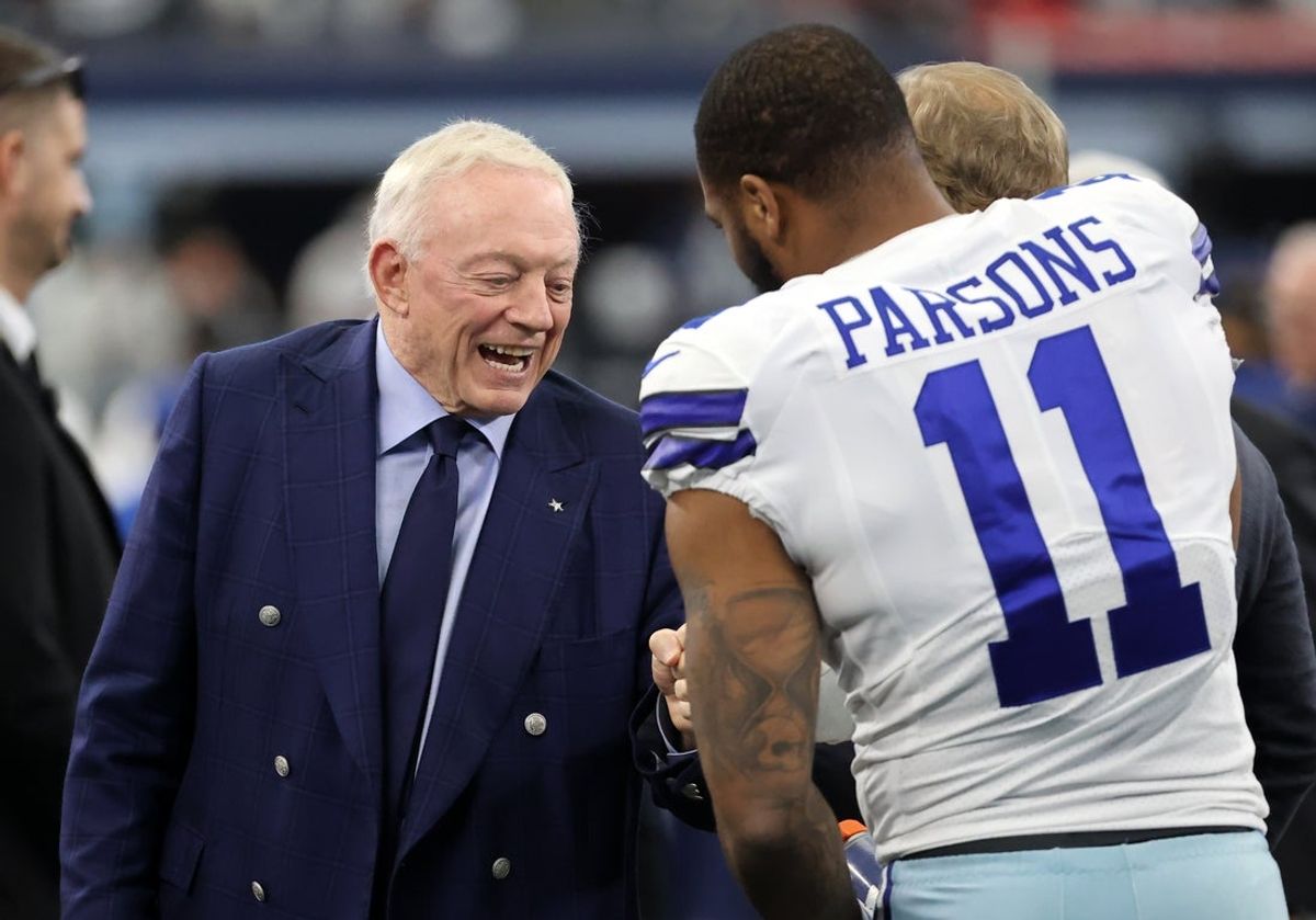 Jan 16, 2022; Arlington, Texas, USA; Dallas Cowboys owner Jerry Jones meets with outside linebacker Micah Parsons (11) prior to the NFC Wild Card playoff football game against the San Francisco 49ers at AT&T Stadium. Mandatory Credit: Kevin Jairaj-Imagn Images