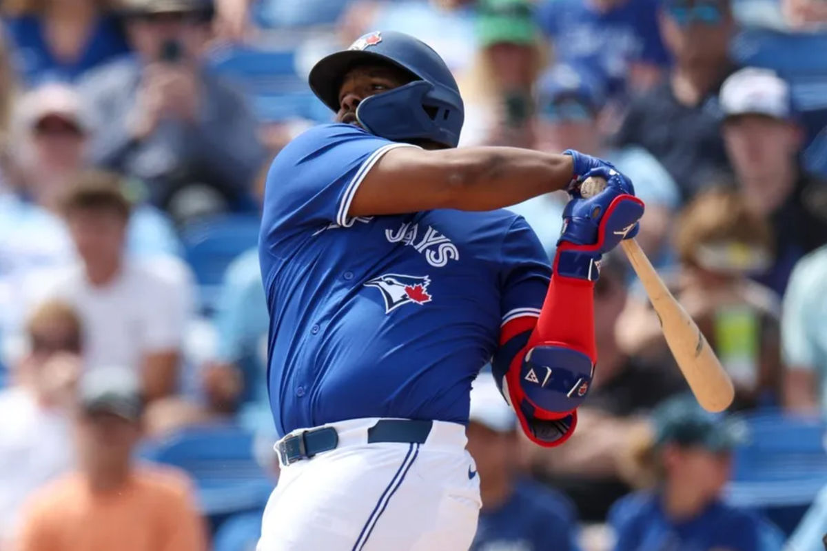Mar 20, 2025; Dunedin, Florida, USA; Toronto Blue Jays first base Vladimir Guerrero Jr. (27) singles against the Tampa Bay Rays in the fifth inning during spring training at TD Ballpark. Mandatory Credit: Nathan Ray Seebeck-Imagn Images
