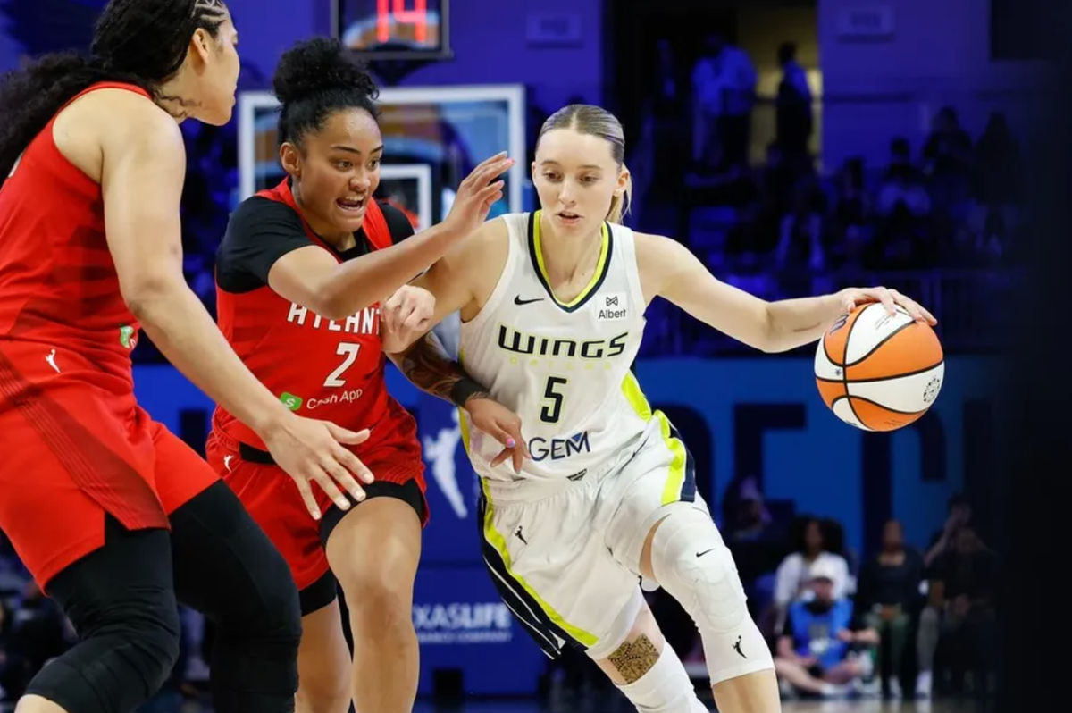Jun 24, 2025; Arlington, Texas, USA; Dallas Wings guard Paige Bueckers (5) drives to the basket against Atlanta Dream guard Te-Hina Paopao (2) during the second half at College Park Center. Mandatory Credit: Chris Jones-Imagn Images