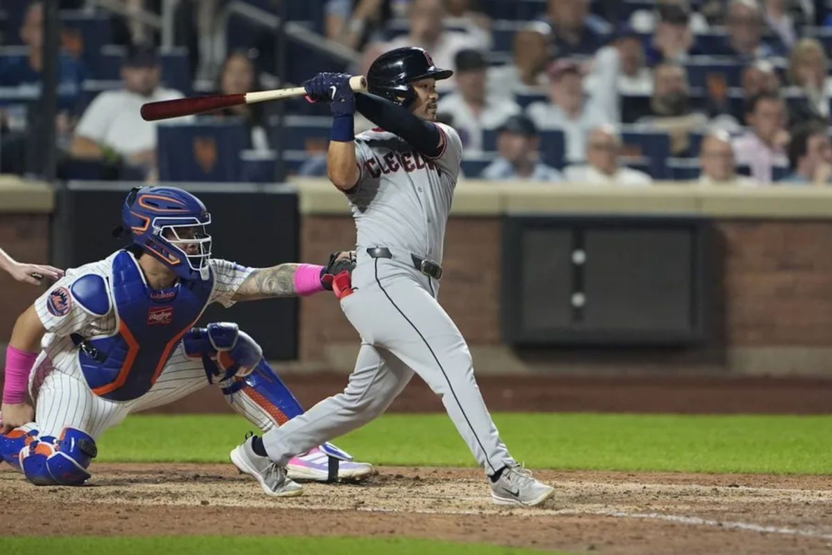 Aug 5, 2025; New York City, New York, USA; Cleveland Guardians left fielder Steven Kwan (38) hits a RBI single against the New York Mets during the seventh inning at Citi Field. Mandatory Credit: Gregory Fisher-Imagn Images