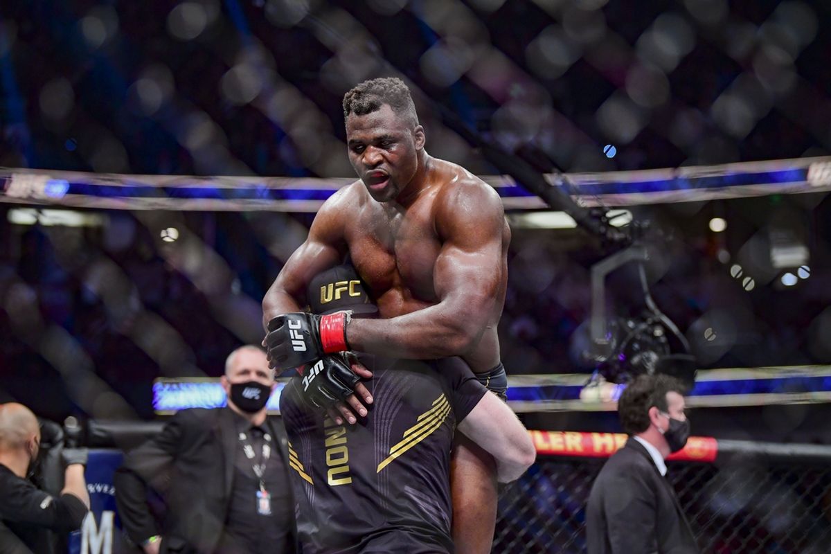Jan 22, 2022; Anaheim, California, USA; Francis Ngannou (red gloves) celebrates after the fight against Ciryl Gane (blue gloves) during UFC 270 at Honda Center. Mandatory Credit: Gary A. Vasquez-USA TODAY Sports