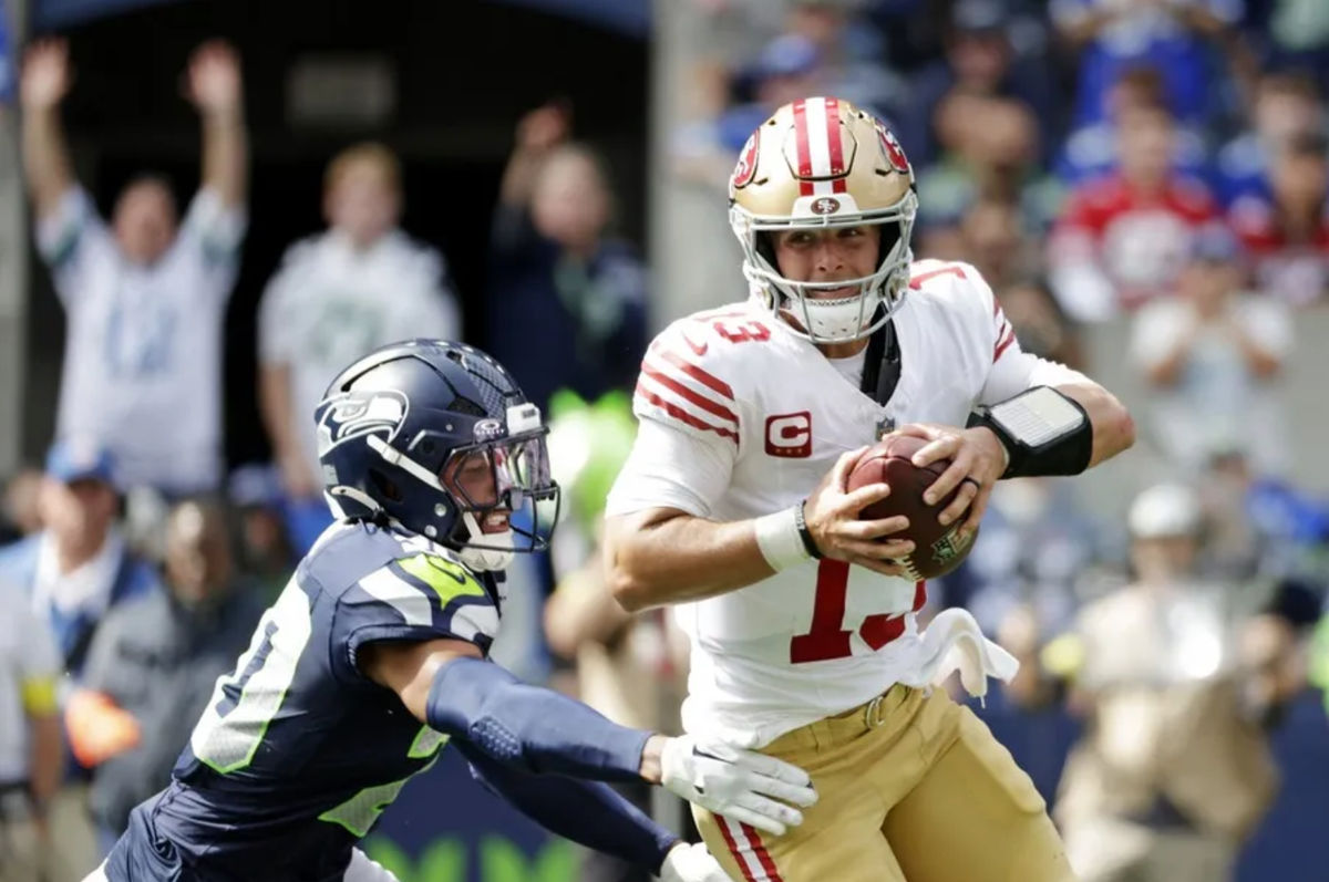 Sep 7, 2025; Seattle, Washington, USA; San Francisco 49ers quarterback Brock Purdy (13) runs the ball during the first half against the Seattle Seahawks at Lumen Field. Mandatory Credit: Joe Nicholson-Imagn Images