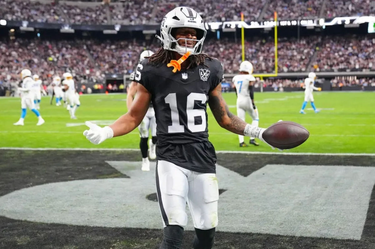 Jan 5, 2025; Paradise, Nevada, USA; Las Vegas Raiders wide receiver Jakobi Meyers (16) celebrates after scoring a touchdown against the Los Angeles Chargers during the second quarter at Allegiant Stadium. Mandatory Credit: Stephen R. Sylvanie-Imagn Images