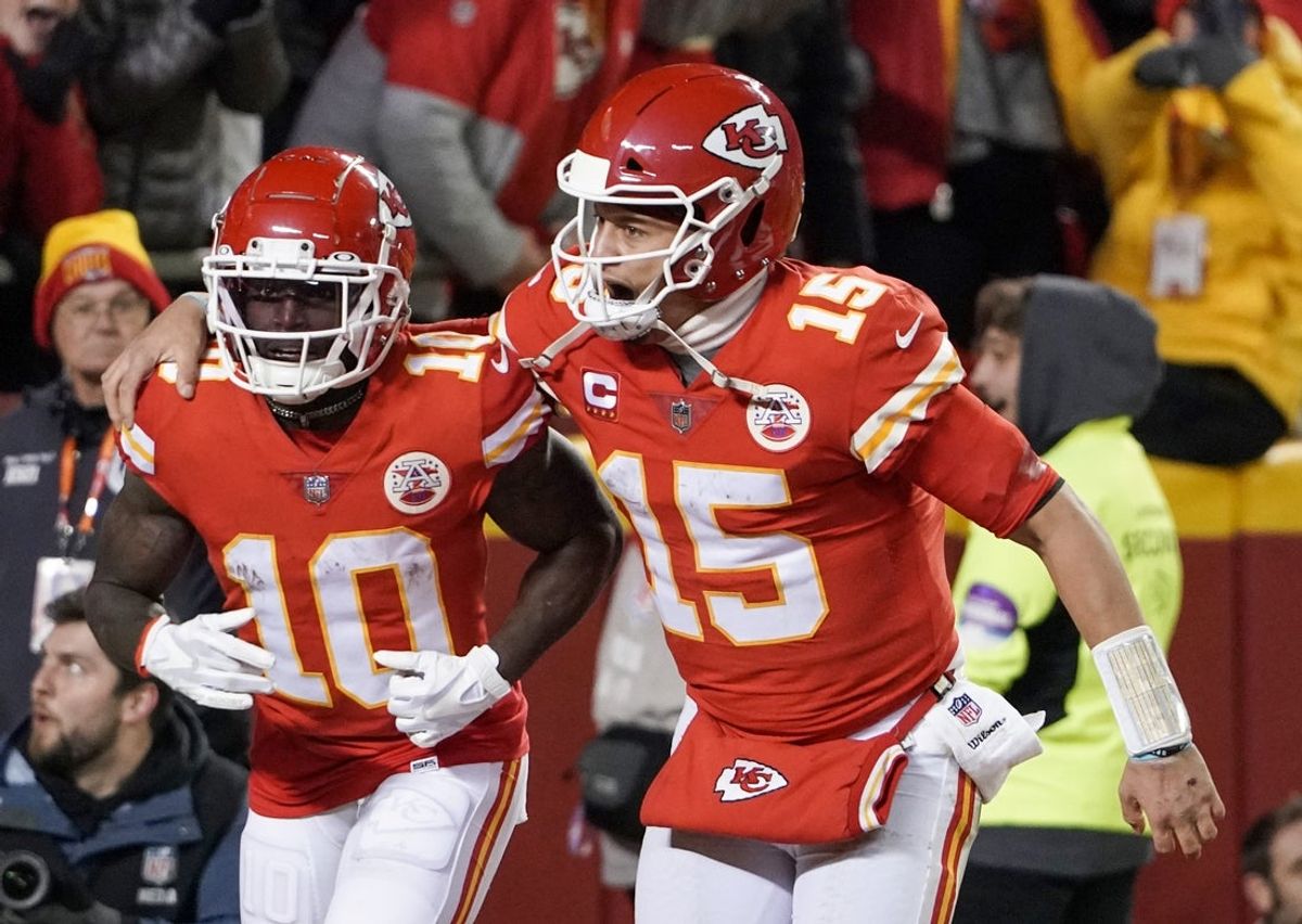 Jan 23, 2022; Kansas City, Missouri, USA; Kansas City Chiefs quarterback Patrick Mahomes (15) celebrates with wide receiver Tyreek Hill (10) after Hill scored against the Buffalo Bills during an AFC Divisional playoff football game at GEHA Field at Arrowhead Stadium. Mandatory Credit: Denny Medley-Imagn Images