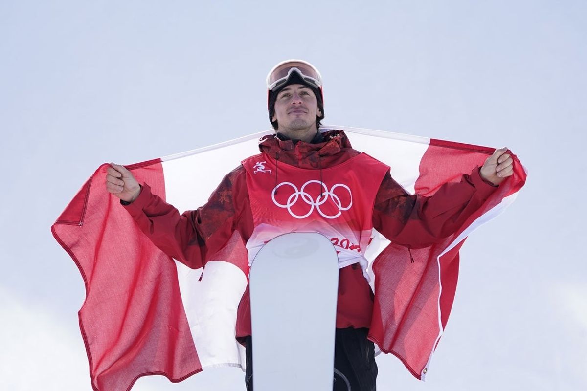 Feb 7, 2022; Zhangjiakou, China; Bbronze medalist Mark Mcmorris (CAN) celebrates after the men's slopestyle snowboarding final during the Beijing 2022 Olympic Winter Games at Genting Snow Park. Mandatory Credit: Jack Gruber-Imagn Images