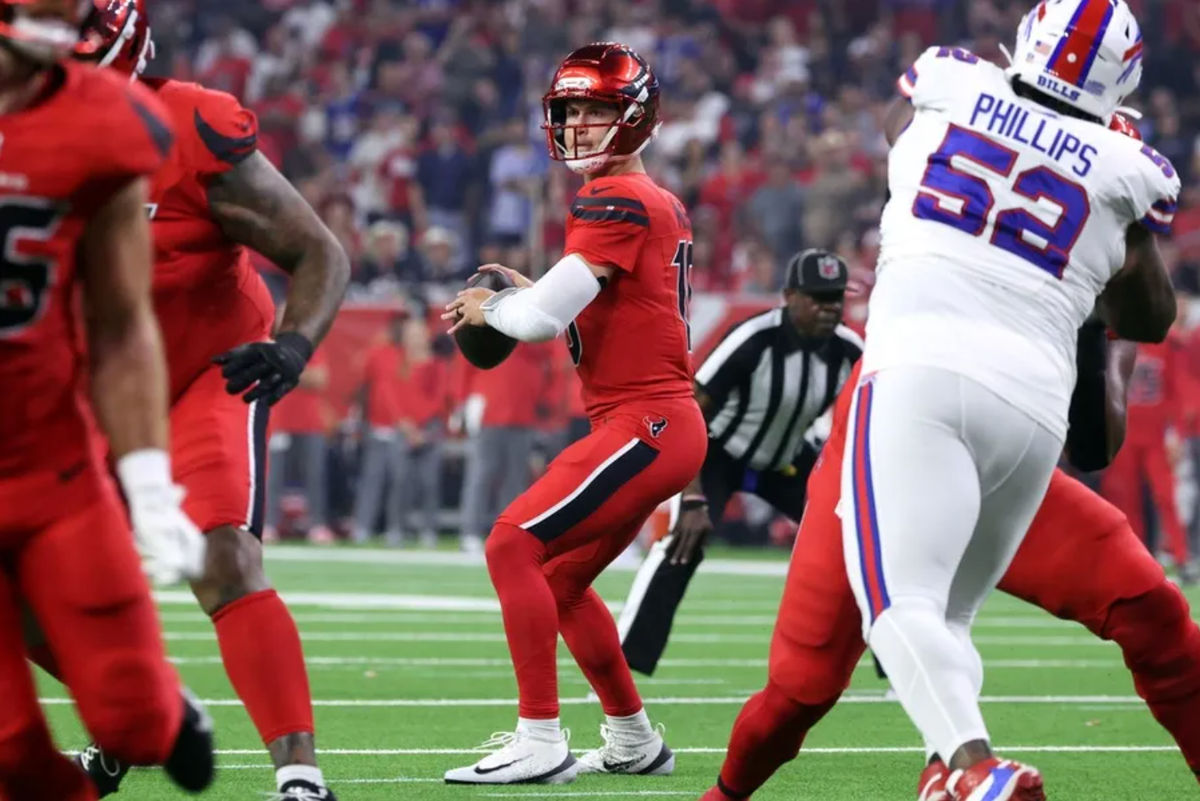 Nov 20, 2025; Houston, Texas, USA; Houston Texans quarterback Davis Mills (10) looks to pass against the Buffalo Bills in the first quarter at NRG Stadium. Mandatory Credit: Troy Taormina-Imagn Images
