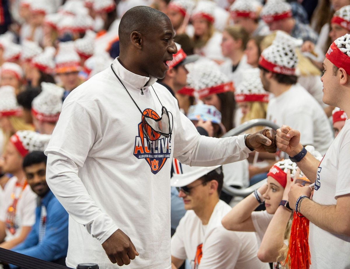 Former Auburn Athletic Director Allen Greene, reportedly hired at Pitt on Friday, pictured in a file photo greeting students before Auburn Tigers men's basketball takes on Texas A&M Aggies at Auburn Arena in Auburn, Ala., on Saturday, Feb. 12, 2022.