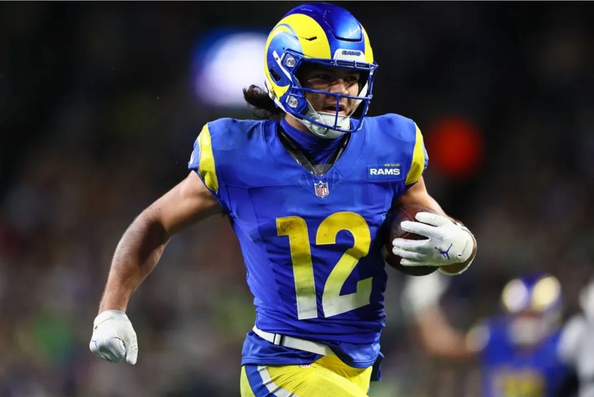 Dec 18, 2025; Seattle, Washington, USA; Los Angeles Rams wide receiver Puka Nacua (12) runs for a touchdown against the Seattle Seahawks in overtime at Lumen Field. Mandatory Credit: Kevin Ng-Imagn Images