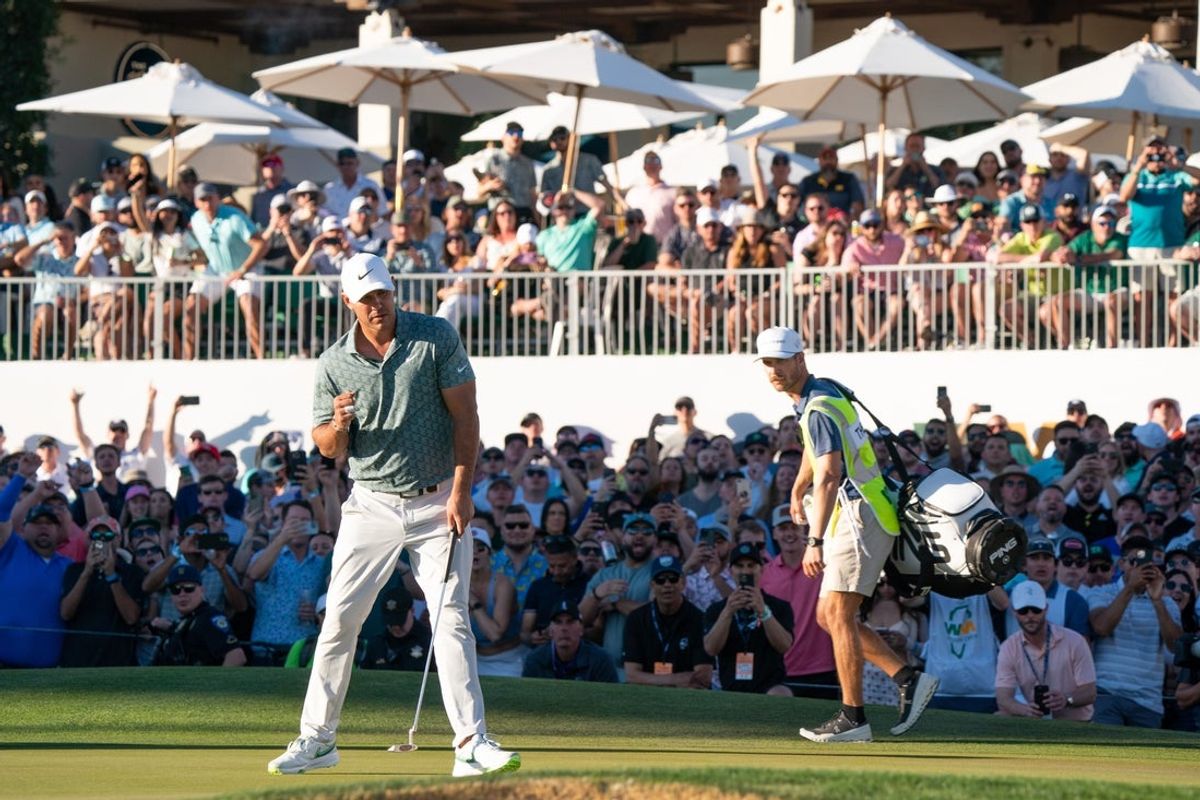 Feb 12, 2022; Scottsdale, Arizona, USA; Brooks Koepka reacts after making par from 17    on the 18th hole during the third round of the WM Phoenix Open golf tournament. Mandatory Credit: Allan Henry-Imagn Images