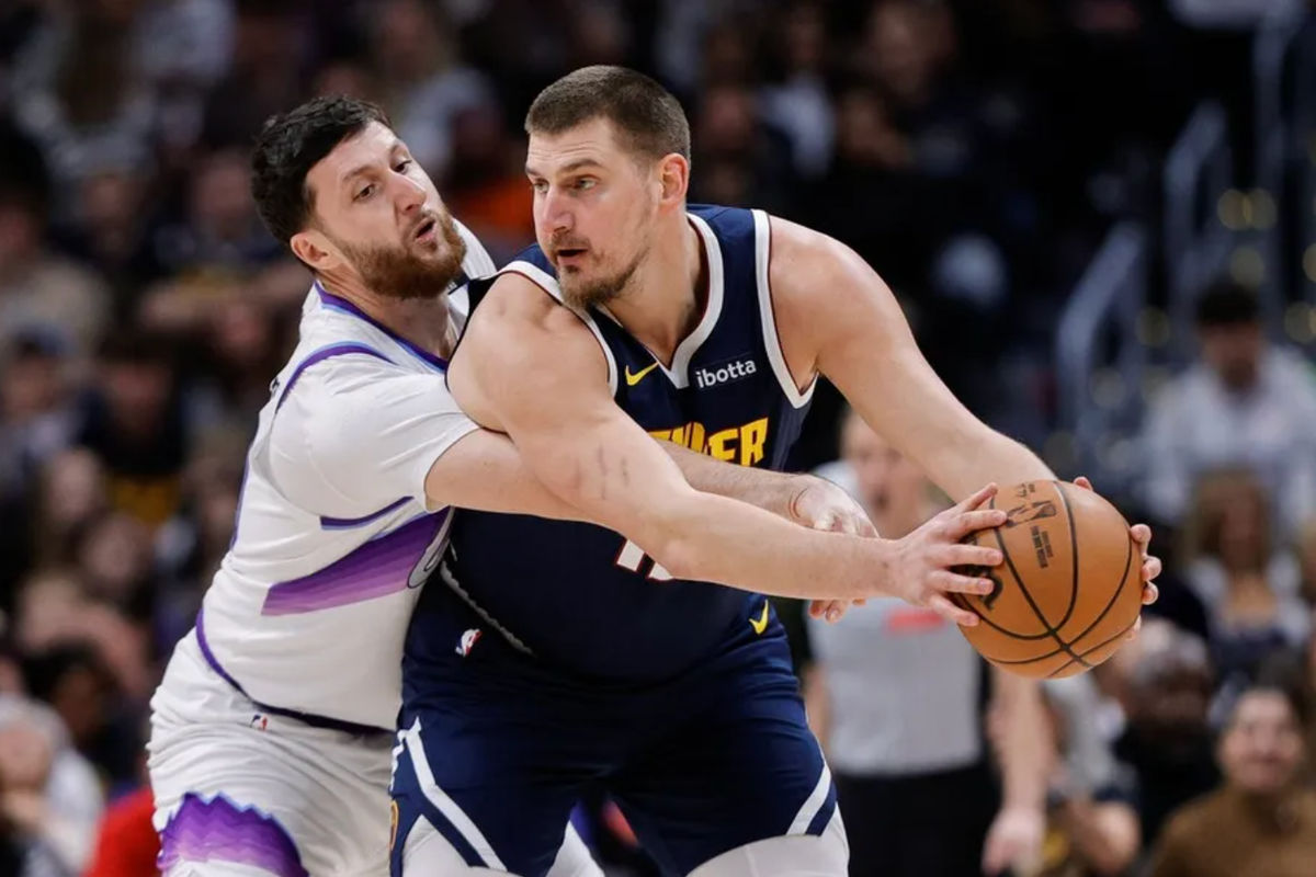 Dec 22, 2025; Denver, Colorado, USA; Denver Nuggets center Nikola Jokic (15) controls the ball under pressure from Utah Jazz center Jusuf Nurkic (30) in the first quarter at Ball Arena. Mandatory Credit: Isaiah J. Downing-Imagn Images