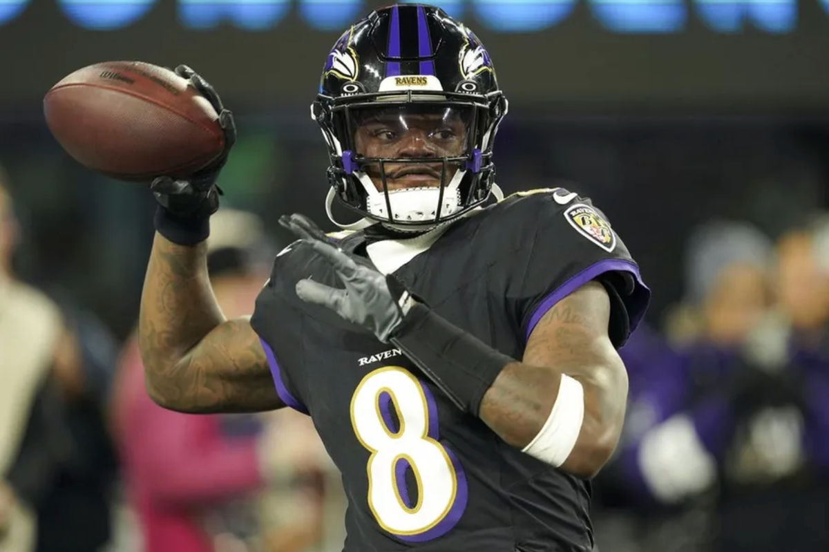 Dec 21, 2025; Baltimore, Maryland, USA; Baltimore Ravens quarterback Lamar Jackson (8) warms up prior to the game against the New England Patriots at M&T Bank Stadium. Mandatory Credit: Mitch Stringer-Imagn Images