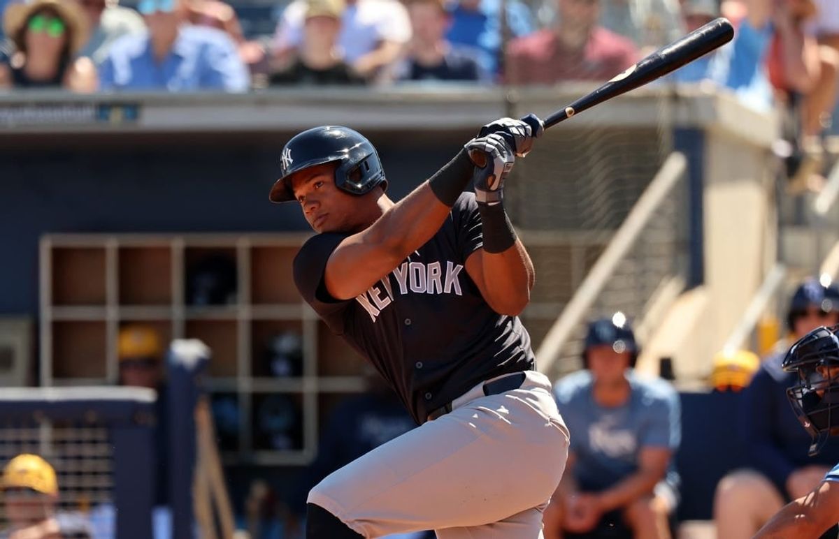 Feb 27, 2024; Port Charlotte, Florida, USA;  New York Yankees outfielder Oscar Gonzalez (72) singles during the second inning against the Tampa Bay Rays at Charlotte Sports Park.