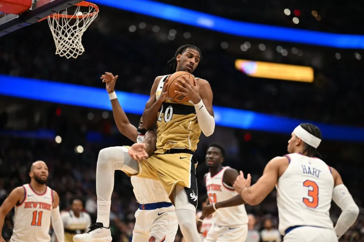 Feb 3, 2026; Washington, District of Columbia, USA; Washington Wizards center Alex Sarr (20) grabs a rebound in front of New York Knicks guard Josh Hart (3) during the first quarter at Capital One Arena. Mandatory Credit: Rafael Suanes-Imagn Images