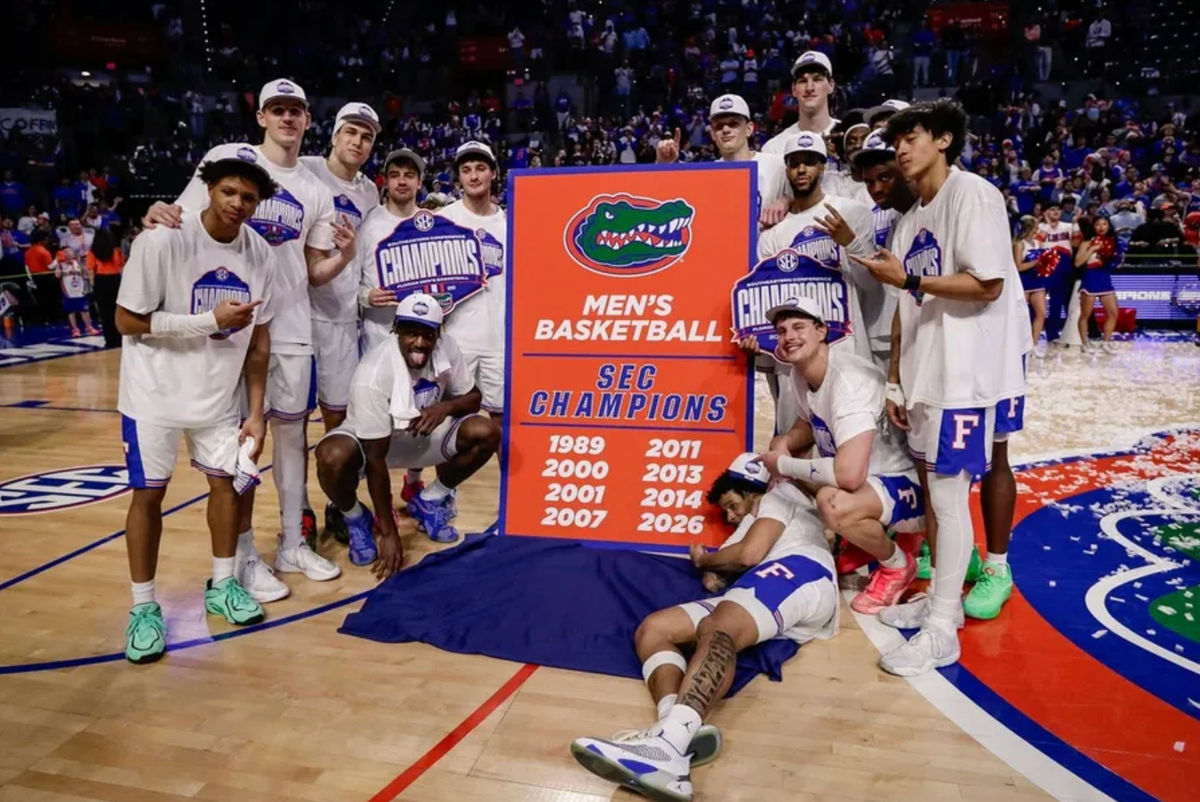 Feb 28, 2026; Gainesville, Florida, USA; Florida Gators players pose for a team photo while celebrating the SEC regular season championship following the game against the Arkansas Razorbacks at Exactech Arena at the Stephen C. O'Connell Center. Mandatory Credit: Travis Register-Imagn Images