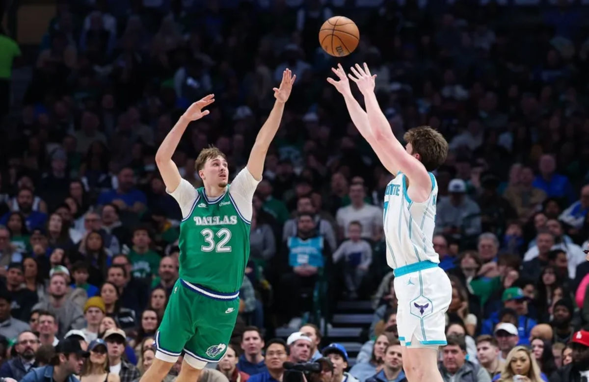 Jan 29, 2026; Dallas, Texas, USA; Charlotte Hornets guard Kon Knueppel (7) shoots over Dallas Mavericks forward Cooper Flagg (32) during the second half at American Airlines Center. Mandatory Credit: Kevin Jairaj-Imagn Images