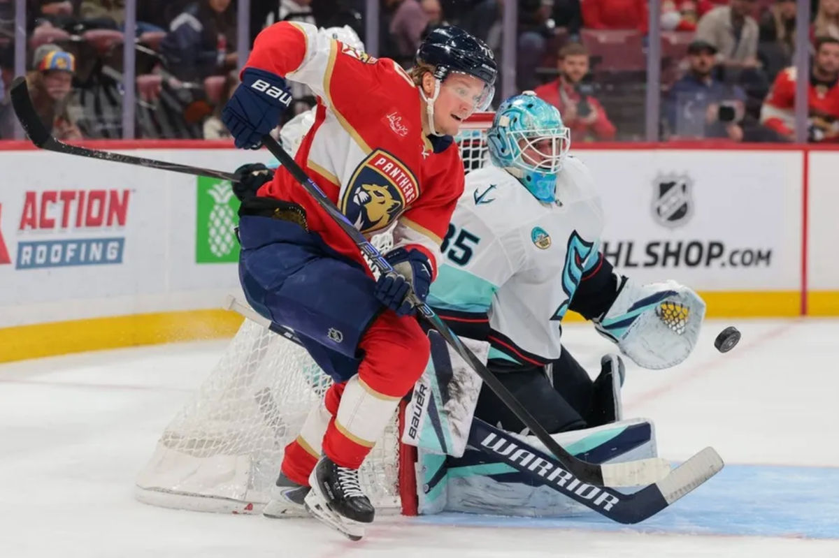 Mar 24, 2026; Sunrise, Florida, USA; Florida Panthers center Jesper Boqvist (70) attempts to score against Seattle Kraken goaltender Joey Daccord (35) during the first period at Amerant Bank Arena. Mandatory Credit: Sam Navarro-Imagn Images