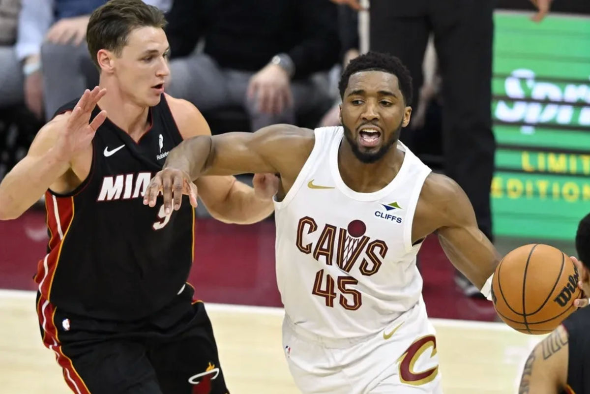 Mar 25, 2026; Cleveland, Ohio, USA; Miami Heat guard Pelle Larsson (9) defends Cleveland Cavaliers guard Donovan Mitchell (45) in the fourth quarter at Rocket Arena. Mandatory Credit: David Richard-Imagn Images