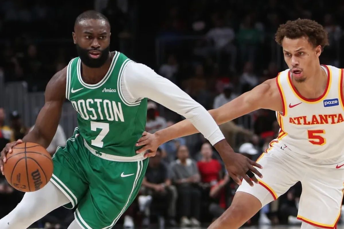 Mar 30, 2026; Atlanta, Georgia, USA; Boston Celtics guard Jaylen Brown (7) dribbles against Atlanta Hawks guard Dyson Daniels (5) in the first half at State Farm Arena. Mandatory Credit: Mady Mertens-Imagn Images