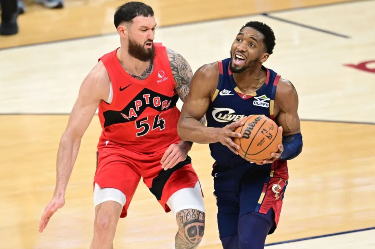Apr 20, 2026; Cleveland, Ohio, USA; Cleveland Cavaliers guard Donovan Mitchell (45) drives on Toronto Raptors forward Sandro Mamukelashvili (54) during the first half during game two of the first round of the 2026 NBA Playoffs at Rocket Arena. Mandatory Credit: David Dermer-Imagn Images